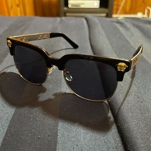 Black sunglasses with gold detailing